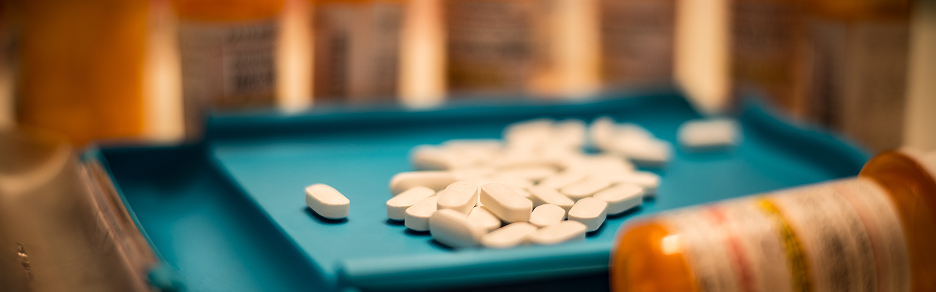 drug capsules on green baize table